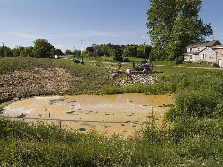 View of retention pond filled with corn mash spilled from Didion Ethanol plant